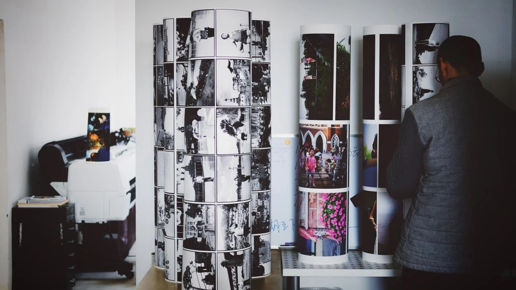 Markos and Sofia reviewing printed brand sheets in the East 6th Street studio.